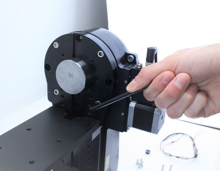 Use a 5 mm hex key to remove the four M6 screws.