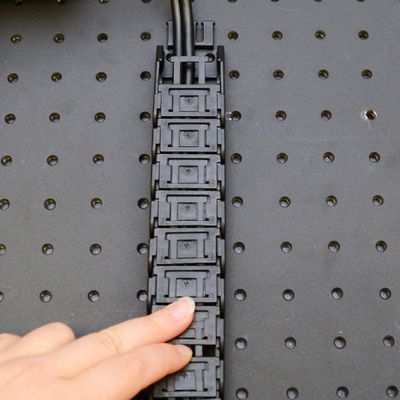 Close the CGxx cable guide by clicking the parts together. Note: The CGxx cable guide parts must be oriented as shown to click together.