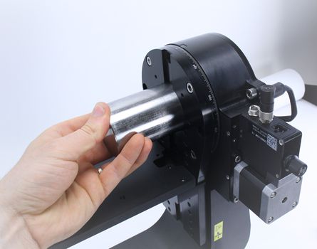 Insert 2” precision alignment pin into the elevation axis stage aperture. You may need to lower the crossmember plate to fully expose the aperture and alternative elevation mount holes.