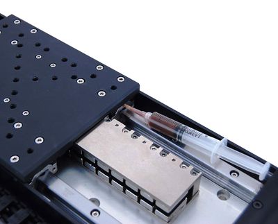 1. Remove power to the device before attempting to lubricate. 2. Re-lubricate at four of the ports shown above on the stage.