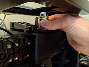 Remove the objective by pulling it straight back and away from the holder.