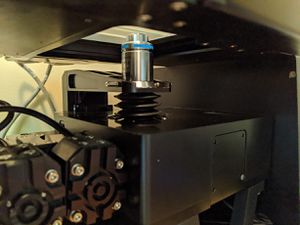 Raise the objective back to the focal height by pressing button 2.