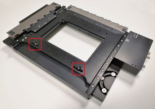 The highlighted cable ties need to be cut and removed prior to powering up the device.
