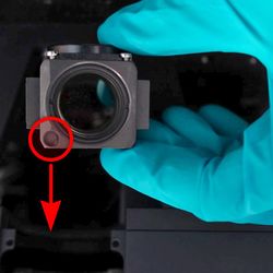 Insert the filter cube (sold separately), ensuring the alignment mark is on the bottom side of the filter cube. Gloves are recommended when handling optical components to avoid marking surfaces with fingerprints.