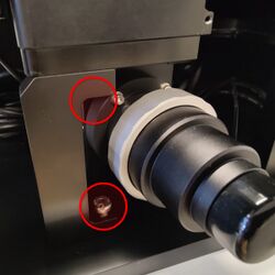 Replace the filter cube turret support. Install and tighten the screws.