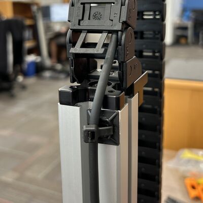 Where there are no prongs available, use adhesive-backed cable tie mounts (provided in the CGxxT kit) to secure cables to a surface near the exit of the cable guide.