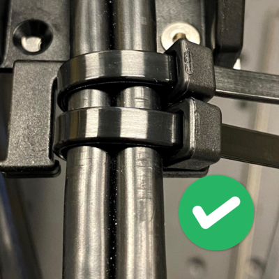 To create the upper strain relief tighten two cable ties on the upper prongs of the CGxxT and the cable. The cable ties should be loose enough that you can move the cable though them fairly easily by hand, but tight enough to constrain the external cable jacket. This allows the internal cable wires to move through the strain relief to relieve bending stresses during motion.