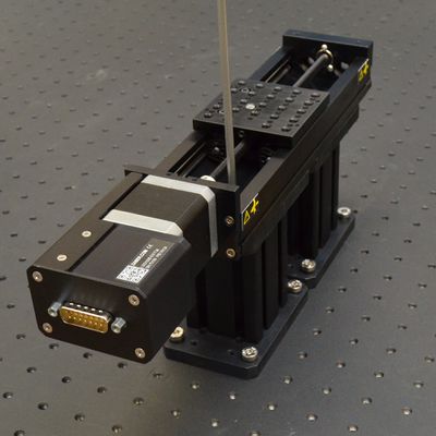 Mount stages to top of risers using the provided M6 x 8 mm low profile screws. Start by installing two screws diagonally for each riser, leaving screws just a bit loose. Firmly tighten the riser to breadboard screws once the X-axis stages are assembled on top.