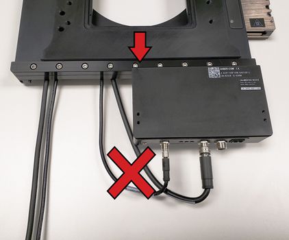 2. Manually ensure the lower axis can move through it's full travel range without kinking or straining the cables before powering up the device. If the cables don't have enough slack (shown above), loosen off the washers and add more slack to the cables.