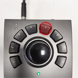 Press and hold button 5. This will home the XY stage to calibrate its reference position. Without a calibrated reference, the stage will operate in safe-mode, limiting its travel range. Hold button 5 until both axes of the stage have stopped moving. Releasing button 5 will return the stage to the centered position.