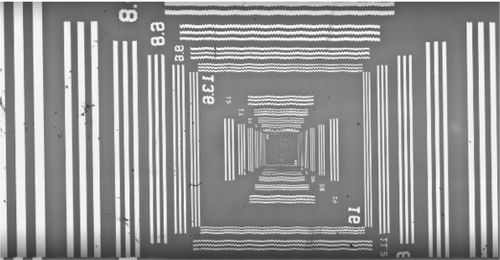 Wavy TDI scan image indicating servo tuning needs adjustment