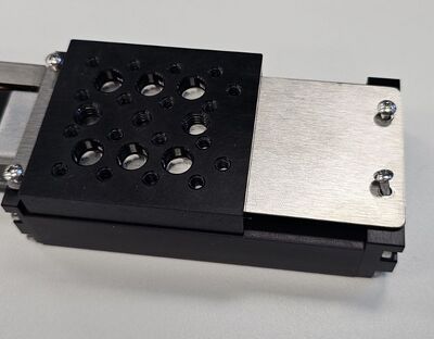 To reinstall the dust cover, simply slide the cover back into place in the same orientation, and return the four M2 screws to each corner