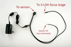 Locate the supplied autofocus IO and power cable assembly†