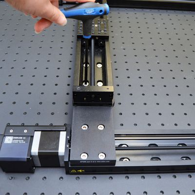 When the X-axis stages are aligned well, tighten the four screws connecting the AP200 part 2 to the Y-axis stage, while ensuring both dowels remain in contact with the side of the Y-axis stage. Leave the screws connecting the AP200 part 2 to the X-axis stage loose for now.