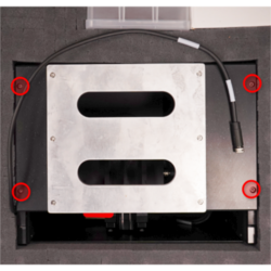 Remove the 4 screws securing the shipping handle support plates to the vertical stage supports. Keep these screws to mount the XY stage.