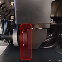 Remove the front right filter cube turret support.