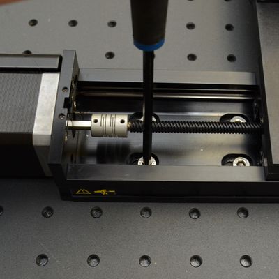 Move the X-axis stages to expose the mounting screws at the home end of X-axis travel. Firmly tighten the screws at the home end of X-axis travel. The X & Y axes should now be aligned and secure. To confirm that the stages move well, home the lockstep group in Zaber Launcher, then move the X-axis and Y-axis stages throughout their travel ranges using either Zaber Launcher or the manual control knobs. See Troubleshooting if stages are not moving well together.