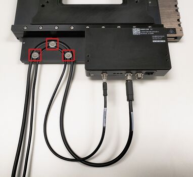 1. Remove the 3 washers shown with a Phillips screwdriver. Insert the cables into each slot, then reattach all 3 washers. Connect the cables to the stage's controller.