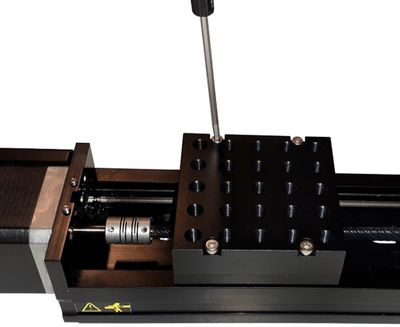 If the stage top was removed, install the four M3 x 16 mm screws. Make sure the stage top edge is aligned to the carriage edge. Tighten screws to 1.3 Nm using a 2.5 mm hex key.