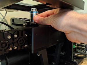 Load the new objective by pushing it firmly into the objective holder until it clicks into position.