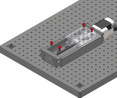 Loosely attach the X-axis stage on a breadboard or other mounting surface using the four provided stainless steel M3 screws and a 2.5 mm hex key. Move the carriage as necessary to access mounting slots. Two holes in the LSM carriage allow M3 screws to pass through to the mounting slots. Where possible, space fasteners out equally and place fasteners at each end of travel.