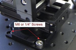 Using either four M6 screws on a 50mm grid or 1/2" screws on a 2" grid attach M-LSM micromanipulator to a flat base.