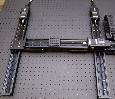 Using the manual control knob for axis 1 or 2, move the X-axis stages along their travel to mid-travel.