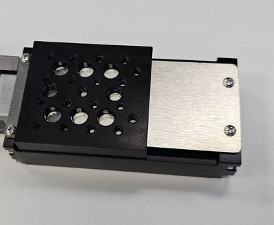 Using a Phillips screwdriver, tighten each screw until you feel slight resistance. Overtightening may strip the threads or cause the dust cover to rub against the carriage.