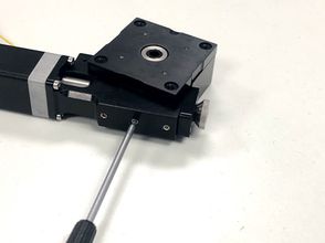 Remove the middle set screw with a 1.5 mm hex key.