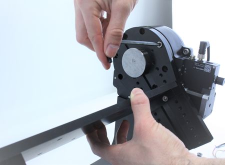 Re-fasten the four M6 screws to re-attach the mount.