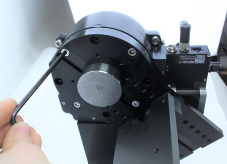 Ensure you use the two low profile M6 screws inside the key alignment feature to allow the crossmember plate to slide up to or past this height. Note: Max torque for these screws is 4.2 N-m. Carefully, remove the alignment pin from the aperture.