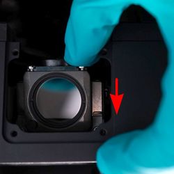 Push down, then forward until the filter “clicks” into place. Repeat for each additional filter cube. Replace the filter cube turret door.