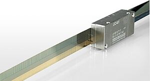Close-up of a linear encoder scale and read head