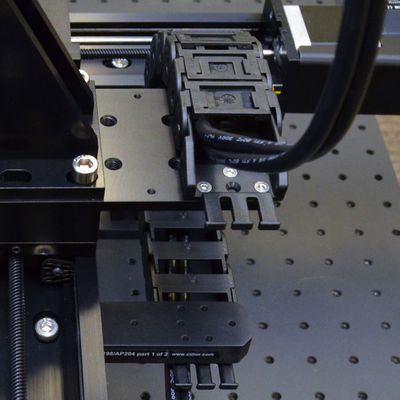 Ensure cable is correctly assembled into guide. See CG Cable Guide and Cable Assembly if not already complete. Connect upper cable guide termination to AP204 part 2 as shown and connect the cable guide to AP204 part 1 as shown.