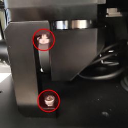 Remove the magnetic side panel of the MVR. Remove the screws holding the front right filter cube turret support.