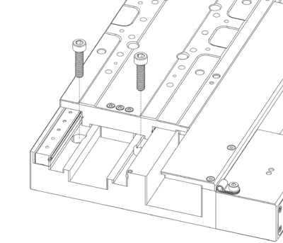 Manually move the stage to its travel limits to access the mounting holes.