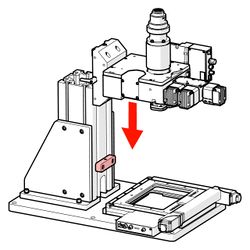 Slowly slide the MKR microscope core and mounting block assembly down onto the MTR support column until it reaches the safety stop.